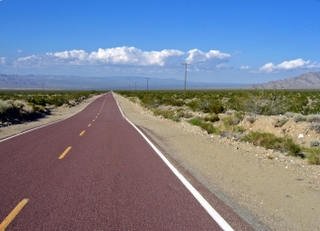 two-lane road through Mojave Preserve in California